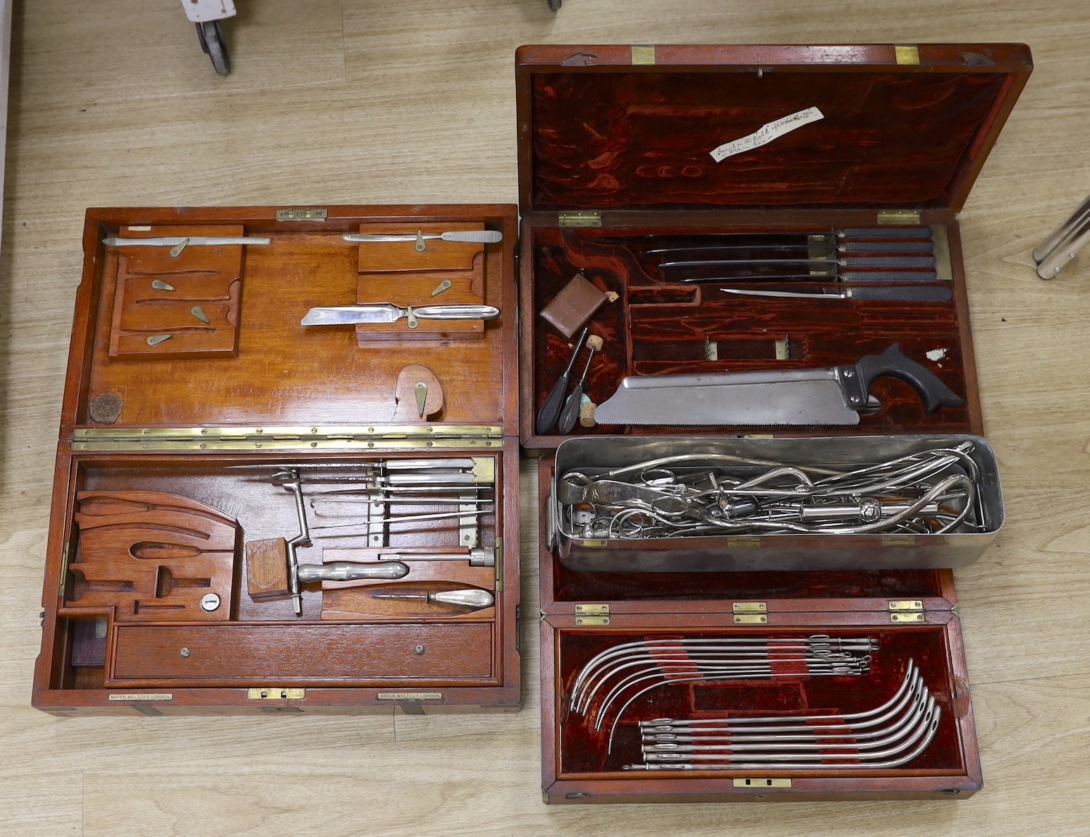 A 19th century mahogany cased field surgeon’s set (incomplete), and other field medical equipment, all three in brass banded mahogany boxes